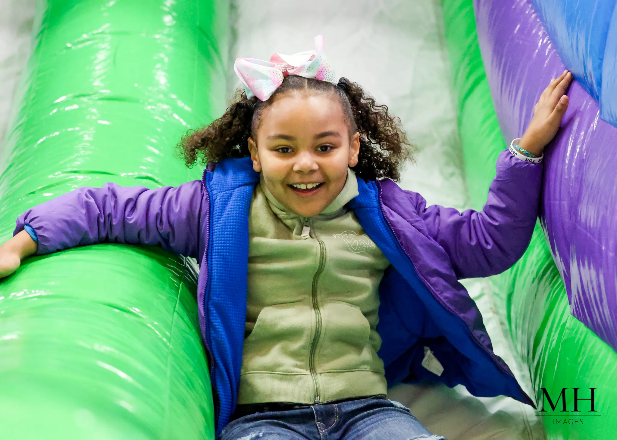 Kids enjoying bounce houses